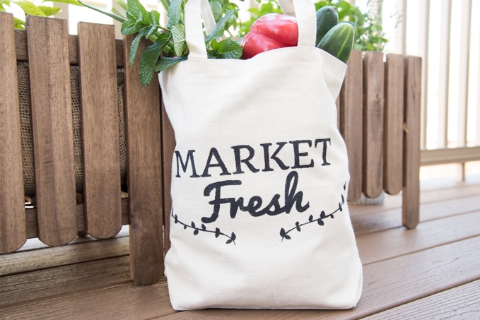Learn how to DIY this cute farmer's market tote bag using the Cricut Explore. See how to use freezer paper to make a stencil in this full craft tutorial.
